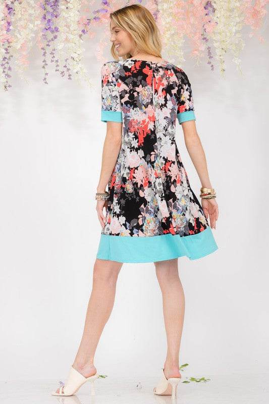 Celeste Full Size Floral Surplice Short Sleeve Dress with Pockets Plus Size - Mayzelyn Shop